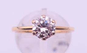 A 9 ct gold and laboratory-grown solitaire diamond ring. Ring size N/O. 2.1 grammes total weight.