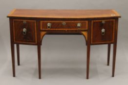 A 19th century satinwood crossbanded mahogany bowfront sideboard. 153 cm wide.