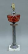 A silver-plated and ruby overlay glass oil lamp (converted). 54 cm high overall.