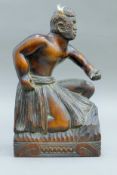 A late 19th/early 20th century large wooden carving of a Maori warrior with abalone-set eyes. 34.