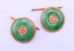 A pair of Chinese jade and unmarked gold cufflinks, the toggle formed as bamboo stalks. 1.