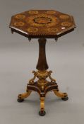 A Victorian inlaid walnut tilt top tripod table. 47 cm wide.