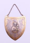 A Polish silver shield shape patriotic gorget 'ryngraf' depicting the Madonna superimposed on a