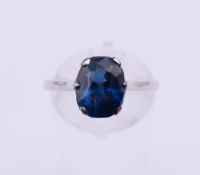 A platinum and sapphire solitaire ring. Ring size P/Q. 3.9 grammes total weight.