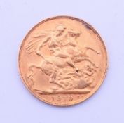 An Edward VII 1910 gold sovereign.