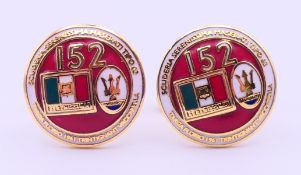 A boxed set of Maserati cufflinks. 2 cm diameter.