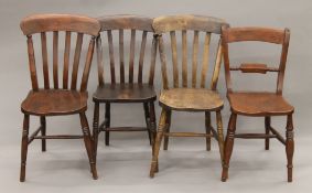 Four 19th century elm-seated country chairs. The smallest 42 cm wide.