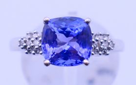 A platinum and tanzanite ring. Ring size M. 5.4 grammes total weight.
