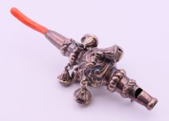 A silver and coral baby rattle with whistle. 14 cm long.