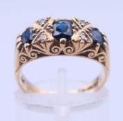 A 9 ct diamond and sapphire ring. Ring size M. 4.1 grammes total weight.