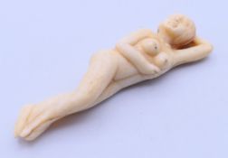 A bone doctor's figure of a nude female. 9.5 cm long.