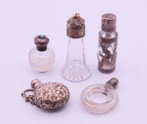 A silver circular chatelaine scent bottle with chain,