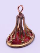 A large carnelian fob seal with intaglio carving of Britannia,