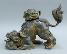 A Chinese bronze dog-of-fo censer. 34 cm long.