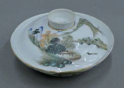 A Chinese porcelain-covered dish with wax seal to base. 19.5 cm diameter.