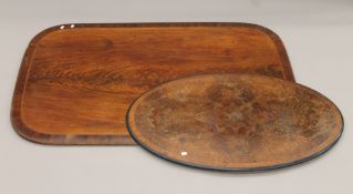 A 19th century mahogany breakfast table top and a Victorian inlaid walnut loo table top.
