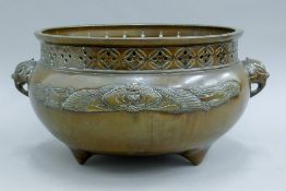 A Japanese patinated bronze elephant-handled censer. 40 cm wide.