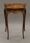 A 19th century inlaid and ormolu-mounted side table. 52 cm wide.