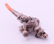 A silver and coral baby rattle and whistle. 10.5 cm long.
