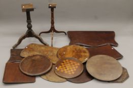 A quantity of 19th century table tops and two tri-pod bases. The largest top 94 cm wide.