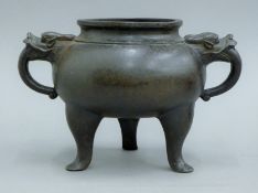 A Chinese bronze censer. 22 cm wide.