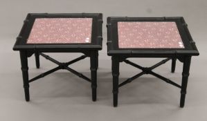 A pair of black painted faux bamboo coffee tables. Each 51 cm squared and 40 cm high.