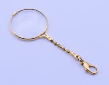 An 18 ct gold magnifying glass. 24.4 grammes total weight. 11.