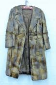 A mink jacket, a beaver lamb coat,