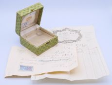 A vacant vintage Cartier box containing a 1925 invoice and receipt from Maquet Graveur, Paris.