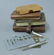 A Hardy Bros leather trout wallet, two further leather trout wallets,