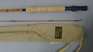 A 9' J S Sharpe The Scottie two-piece split cane fly rod in its maker's canvas sleeve.