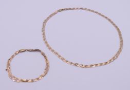 A 9 ct tri-colour gold necklace and matching bracelet. Necklace 43 cm long, bracelet 18.5 cm long.