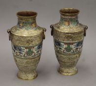 A pair of 19th century Chinese brass and cloisonne vases. Each 25 cm high.
