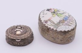 An Eastern unmarked white metal pill box and a white metal snuff box,