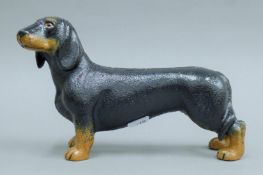 A cast iron dachshund. 24 cm long.