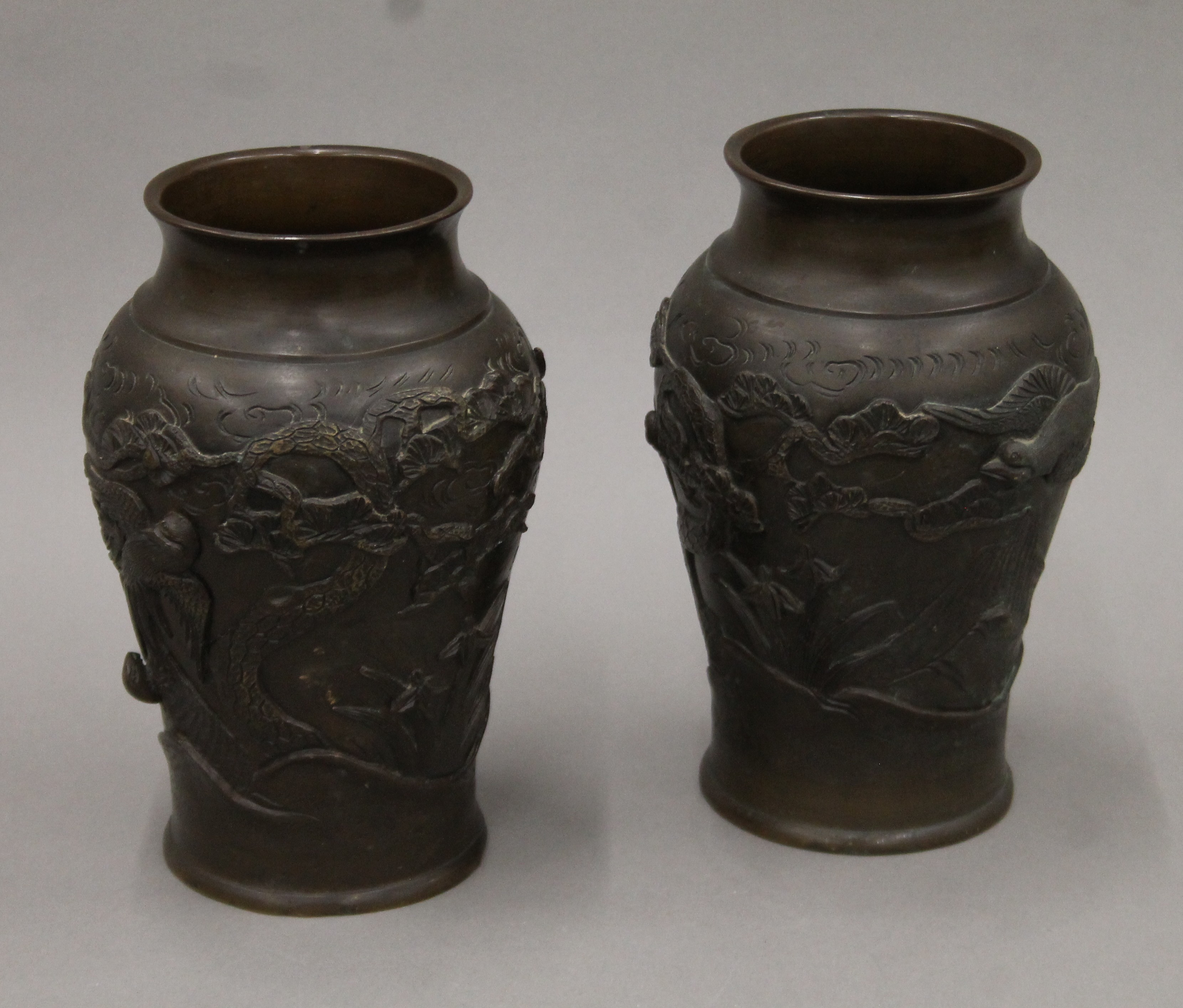 A pair of 19th century Japanese bronze vases. Each 25 cm high.