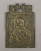 An antique brass religious icon. 12 cm high.