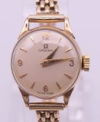 An Omega 9 ct gold ladies bracelet wristwatch,