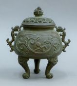 A Chinese pierced-top bronze censer. 19 cm high.