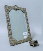 A silver-framed strut mirror,