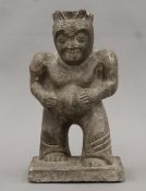 An antique stone carving of the Egyptian God Bes. 31 cm high.