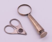 A Sampson Mordon & Co silver magnifying glass and a 900 silver pocket scissor form cigar cutter.