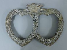 A sterling silver clad double heart photograph frame. 23.5 cm wide.