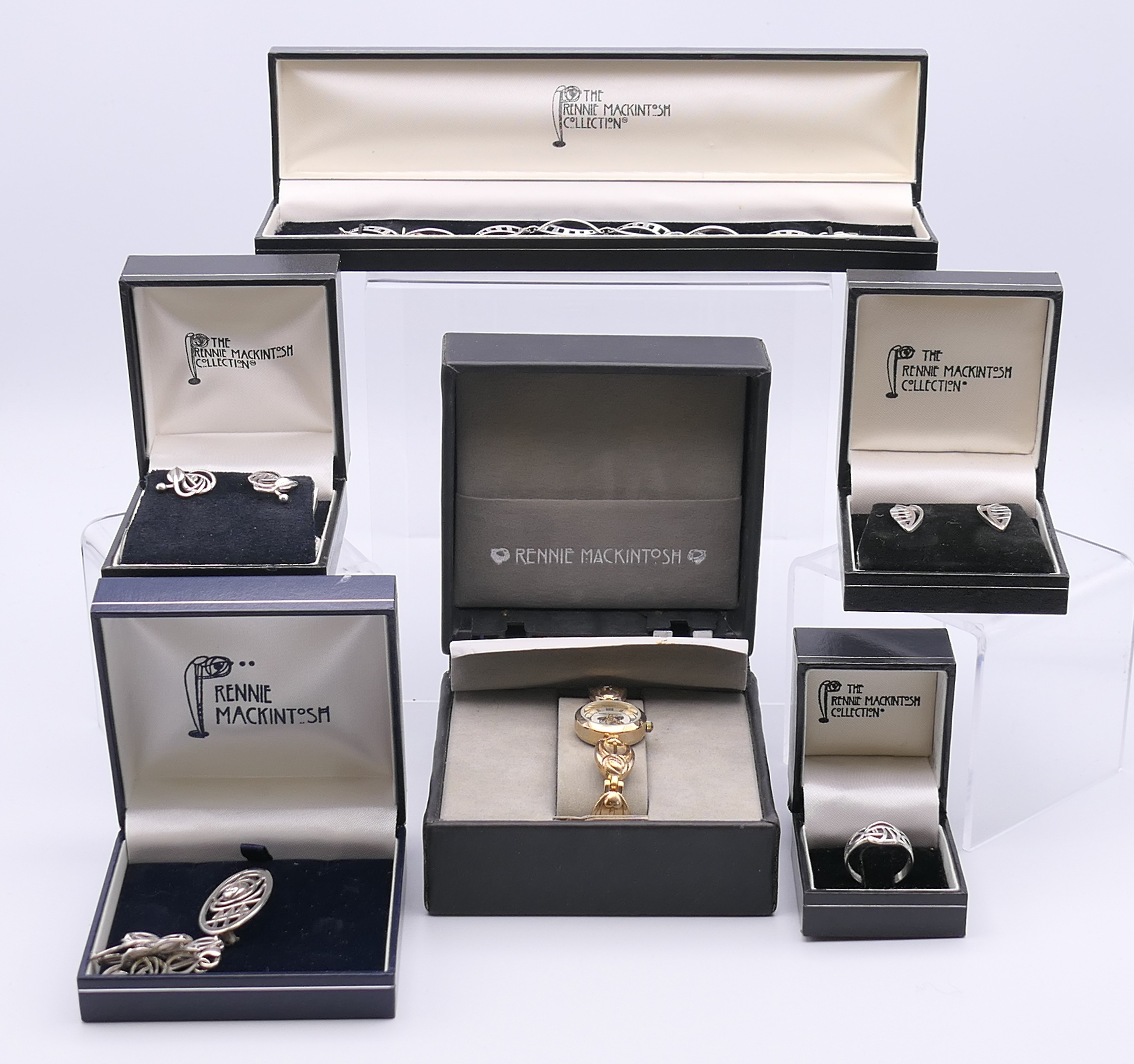 A quantity of boxed 'The Rennie Mackintosh Collection' silver jewellery to include two bracelets,