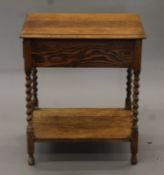 An early 20th century oak single drawer barley twist side table. 42 cm wide.