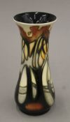 A boxed Moorcroft vase. 21 cm high.