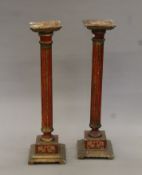 A pair of painted wooden columns. Each 93.5 cm high.