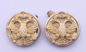 A pair of silver gilt cufflinks bearing Russian marks. 2.5 cm diameter.