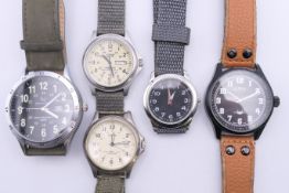 Five military watches. Largest 5 cm diameter including crown.