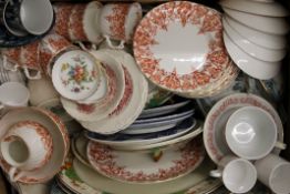 A quantity of porcelain tea and dinner wares. The largest meat plate 35 cm long.